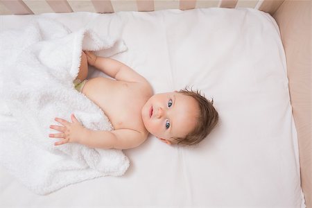 High angle view of adorable baby boy lying in crib Stock Photo - Budget Royalty-Free & Subscription, Code: 400-07335778