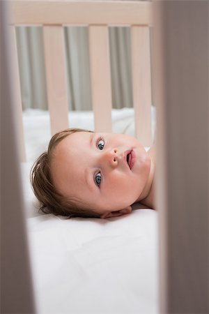 Portrait of cute baby boy in crib Stock Photo - Budget Royalty-Free & Subscription, Code: 400-07335783