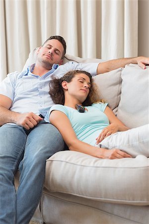 Young couple sleeping on sofa at home Stock Photo - Budget Royalty-Free & Subscription, Code: 400-07335848