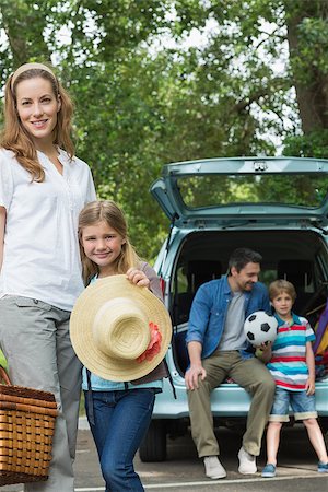 Portrait of mother and daughter with father and son sitting in car trunk Stock Photo - Budget Royalty-Free & Subscription, Code: 400-07336870