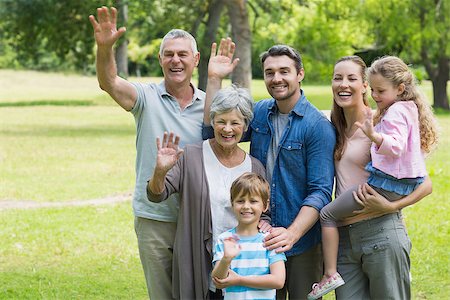 Portrait of a happy extended family waving hands at the park Stock Photo - Budget Royalty-Free & Subscription, Code: 400-07336999