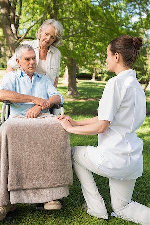 paraplegic women in wheelchairs - Two women with a mature man sitting in wheel chair at the park Stock Photo - Budget Royalty-Free & Subscription, Code: 400-07337122