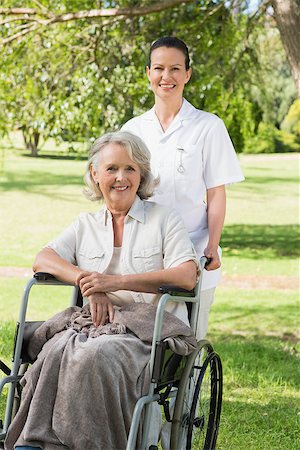 simsearch:400-07337135,k - Portrait of a woman with her mature mother sitting in wheel chair at the park Stock Photo - Budget Royalty-Free & Subscription, Code: 400-07337135