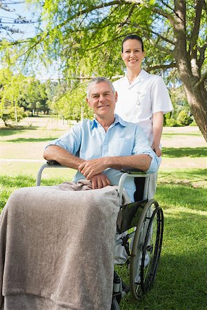 simsearch:400-07337135,k - Woman with her mature father sitting in wheel chair at the park Stock Photo - Budget Royalty-Free & Subscription, Code: 400-07337131