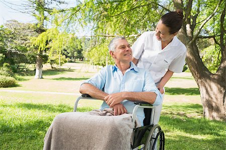 simsearch:400-07337135,k - Woman with her mature father sitting in wheel chair at the park Stock Photo - Budget Royalty-Free & Subscription, Code: 400-07337133