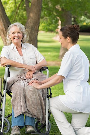 simsearch:400-07337135,k - Portrait of a woman with her mature mother sitting in wheel chair at the park Stock Photo - Budget Royalty-Free & Subscription, Code: 400-07337140