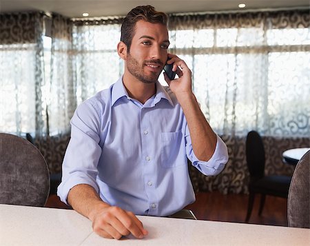 simsearch:400-07139155,k - Happy businessman on the phone after work in a bar Stock Photo - Budget Royalty-Free & Subscription, Code: 400-07337245