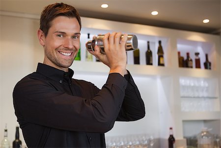 Smiling bartender shaking cocktail at the bar Stock Photo - Budget Royalty-Free & Subscription, Code: 400-07337379