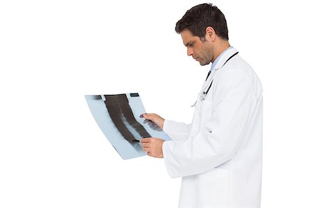 simsearch:400-04552598,k - Serious doctor analysing xray on white background Foto de stock - Super Valor sin royalties y Suscripción, Código: 400-07337417