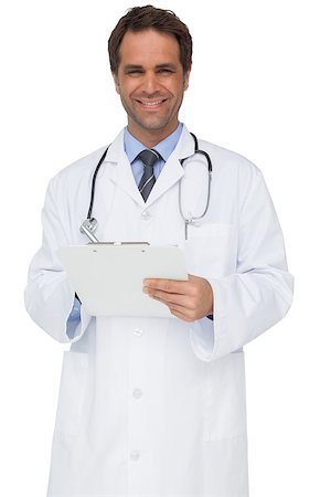 simsearch:400-04217553,k - Handsome doctor smiling at camera holding clipboard on white background Foto de stock - Royalty-Free Super Valor e Assinatura, Número: 400-07337430