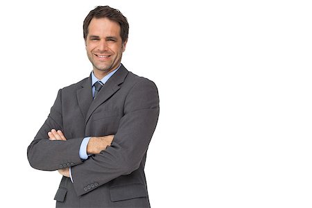 simsearch:400-07274414,k - Handsome businessman smiling at camera with arms crossed on white background Photographie de stock - Aubaine LD & Abonnement, Code: 400-07337466
