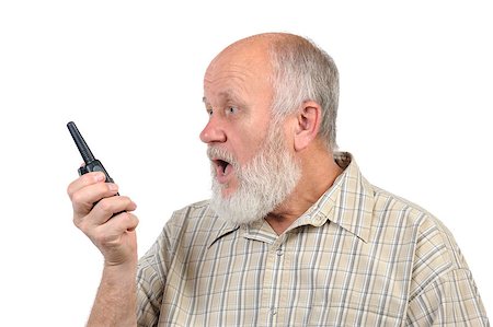 simsearch:400-04485729,k - senior bald man talking using walkie-talkie, with mouth open Stock Photo - Budget Royalty-Free & Subscription, Code: 400-07337648