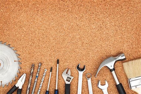 simsearch:400-08674267,k - Set of tools on cork panel background with copy space Photographie de stock - Aubaine LD & Abonnement, Code: 400-07337785