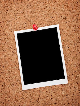 family abstract - Blank instant photo frame on cork wooden background Stock Photo - Budget Royalty-Free & Subscription, Code: 400-07337826