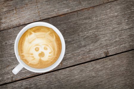 Coffee cup on wooden table. View from above Foto de stock - Super Valor sin royalties y Suscripción, Código: 400-07337828