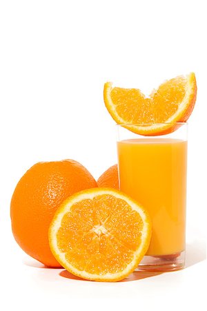 Glass of orange juice, and oranges on white background Stock Photo - Budget Royalty-Free & Subscription, Code: 400-07338520
