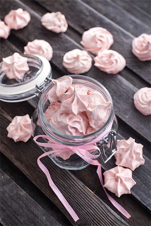 Pink meringues in a glass jar on wooden table Stock Photo - Budget Royalty-Free & Subscription, Code: 400-07338575