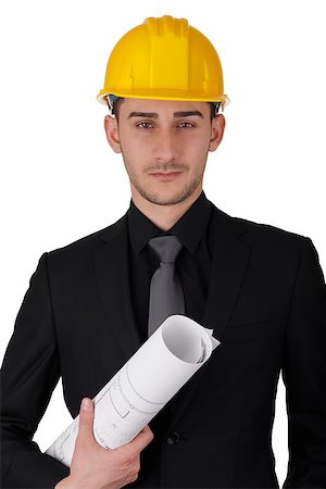 simsearch:400-06098950,k - Young man wearing a hard hat and holding a roll of blueprints Photographie de stock - Aubaine LD & Abonnement, Code: 400-07338676