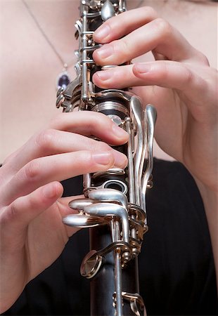 Hands of Young Female Musician Playing Clarinet Stock Photo - Budget Royalty-Free & Subscription, Code: 400-07338879