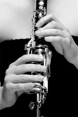 Hands of Young Female Musician Playing Clarinet Stock Photo - Budget Royalty-Free & Subscription, Code: 400-07338880