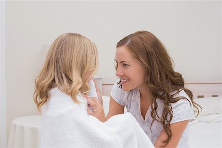 Side view of a mother wiping daughter after a shower at home Stock Photo - Budget Royalty-Free & Subscription, Code: 400-07339509