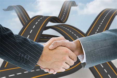 simsearch:400-07339626,k - Composite image of business handshake against crossing roads in the sky Stock Photo - Budget Royalty-Free & Subscription, Code: 400-07339616