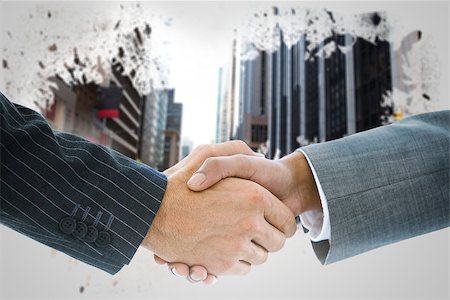 simsearch:400-07339626,k - Composite image of business handshake against splash showing urban scene Stock Photo - Budget Royalty-Free & Subscription, Code: 400-07339630