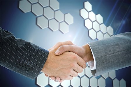 simsearch:400-07339626,k - Composite image of business handshake against technological background with hexagons Stock Photo - Budget Royalty-Free & Subscription, Code: 400-07339659