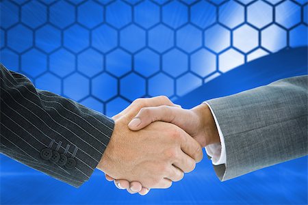 simsearch:400-07339684,k - Composite image of business handshake against hexagons on blue background Stock Photo - Budget Royalty-Free & Subscription, Code: 400-07339652