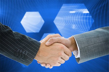simsearch:400-07339626,k - Composite image of business handshake against shiny hexagon on blue background Stock Photo - Budget Royalty-Free & Subscription, Code: 400-07339690