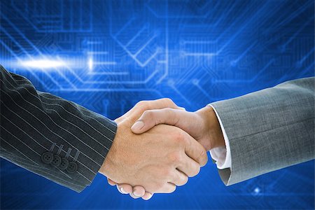 simsearch:400-07339684,k - Composite image of business handshake against futuristic blue circuit board Stock Photo - Budget Royalty-Free & Subscription, Code: 400-07339707