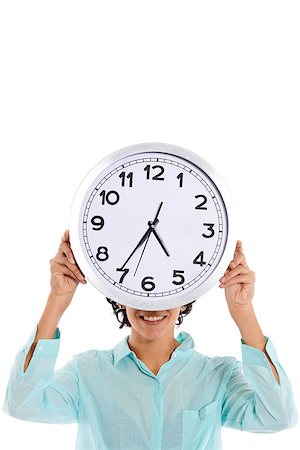 portrait of hispanic business woman hiding behind big watch and looking at camera with happy expression. Isolated on white background Stock Photo - Budget Royalty-Free & Subscription, Code: 400-07330342