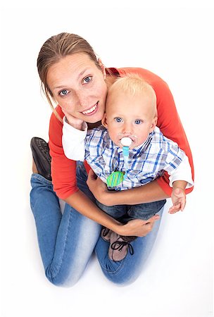 pacifier mom holding - Young Caucasian woman and her baby son over white Stock Photo - Budget Royalty-Free & Subscription, Code: 400-07330938