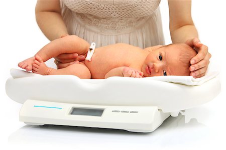 simsearch:400-09096059,k - Newborn baby on a weight scale Photographie de stock - Aubaine LD & Abonnement, Code: 400-07330949