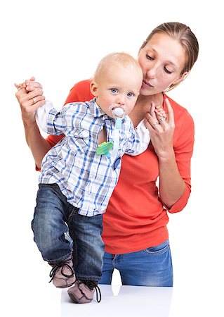 pacifier mom holding - Baby boy learning to walk with mother's help over white Stock Photo - Budget Royalty-Free & Subscription, Code: 400-07330940