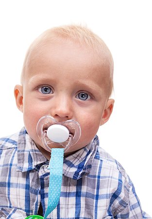 simsearch:400-07329323,k - Closeup of cute blonde blue-eyed little boy with a pacifier Foto de stock - Royalty-Free Super Valor e Assinatura, Número: 400-07330956