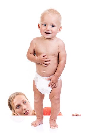 Mother watching her baby boy making first steps Stock Photo - Budget Royalty-Free & Subscription, Code: 400-07330952