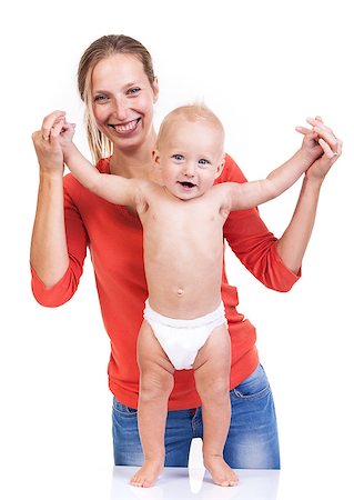 Baby boy learning to walk with mother's help over white Stock Photo - Budget Royalty-Free & Subscription, Code: 400-07330967