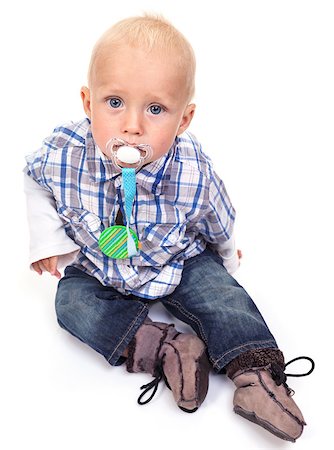 simsearch:400-07329323,k - Closeup of cute blonde blue-eyed little boy with a pacifier Foto de stock - Royalty-Free Super Valor e Assinatura, Número: 400-07330974