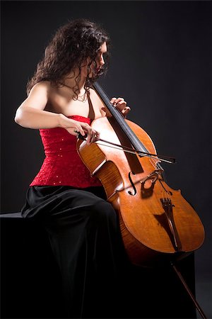 simsearch:400-07338880,k - Young Woman in Red Top Playing Violoncello Stock Photo - Budget Royalty-Free & Subscription, Code: 400-07331123