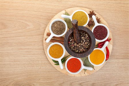 Various spices selection on wooden table Stock Photo - Budget Royalty-Free & Subscription, Code: 400-07331554