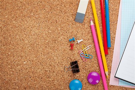 School and office supplies on cork wooden background with copy space Stock Photo - Budget Royalty-Free & Subscription, Code: 400-07331631