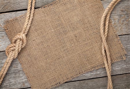 simsearch:400-08050300,k - Ship rope with burlap on old wooden texture background with copy space Foto de stock - Super Valor sin royalties y Suscripción, Código: 400-07331644