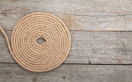 simsearch:400-08050300,k - Roll of ship rope on wooden texture background Foto de stock - Super Valor sin royalties y Suscripción, Código: 400-07331648