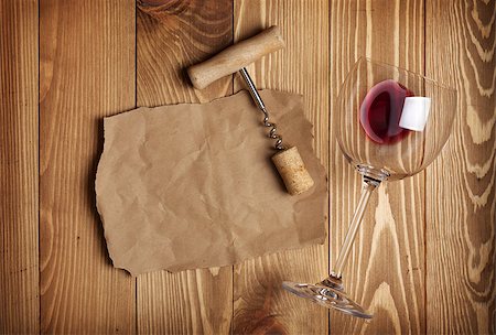 stopper - Red wine glass, corkscrew and paper for your note on wooden table background Stock Photo - Budget Royalty-Free & Subscription, Code: 400-07331664