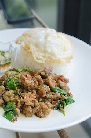 stir fried minced pork with chili , sweet basil served with steamed rice and fried egg Stock Photo - Budget Royalty-Free & Subscription, Code: 400-07331788