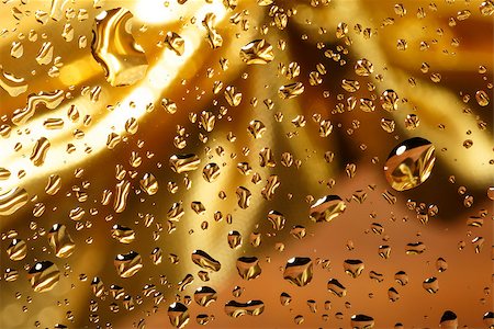 golden abstract background with water drops on glass with gold ribbon in background Stock Photo - Budget Royalty-Free & Subscription, Code: 400-07331939