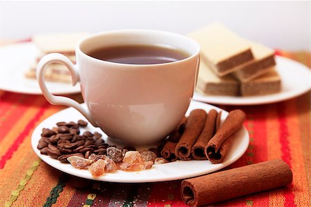 simsearch:400-07321770,k - Cinnamon sticks with white cup on red background Foto de stock - Super Valor sin royalties y Suscripción, Código: 400-07332175