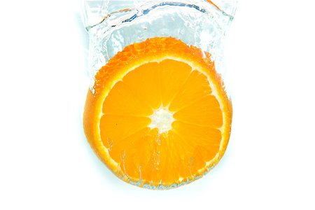 Orange in water splash on white isolated Stock Photo - Budget Royalty-Free & Subscription, Code: 400-07332541