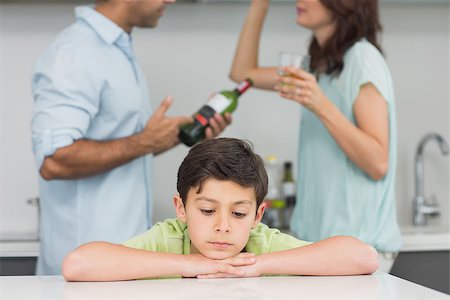 Closeup of a sad son while parents quarreling in the kitchen Stock Photo - Budget Royalty-Free & Subscription, Code: 400-07333593
